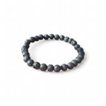 Bracelet en Pierre de Lave 6 mm sur fond blanc, perles volcaniques noires, stabilité, calme intérieur et recentrage.
