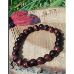 Bracelet œil de taureau 8 mm en cercle sur tranche de bois avec herbes et papillon rouge, perles brun acajou et noir pour ancrage, courage et vitalité stable