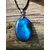 Pendentif Labradorite bleue ovale sur bois naturel, reflet bleu intense, cordon noir et bélière argentée pour protection et intuition.