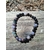 Bracelet tourmaline multicolore 6 mm sur planche de bois en extérieur, perles naturelles violet, vert et noir pour protection et stabilité intérieure
