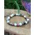 Bracelet déblocages émotionnels en howlite et rhodonite sur décor naturel, apaisement du stress et retour à l’équilibre intérieur