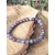 Bracelet tourmaline rose sur eudialyte parmi champignons et décor végétal, perles naturelles pour tendresse du cœur et sérénité intérieure