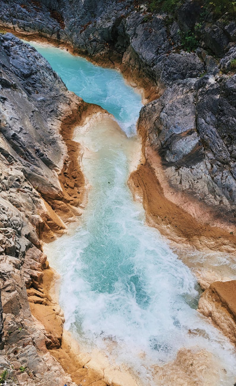 stunning aerial view of vibrant blue river rapids