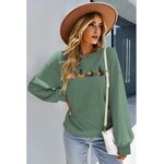 Détail motif chat noir citrouille imprimé sweat-shirt Halloween vert