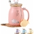 Tasse à café MengCat en céramique rose, décorée de motifs félins, utilisée lors d’un petit-déjeuner convivial.