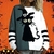femme portant un pull d’Halloween au motif chat effrayant
