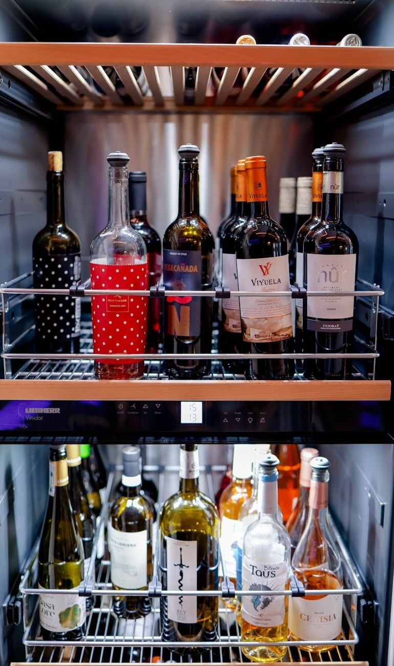 a variety of wine bottles elegantly displayed inside a sleek wine refrigerator perfect for any wine enthusiast