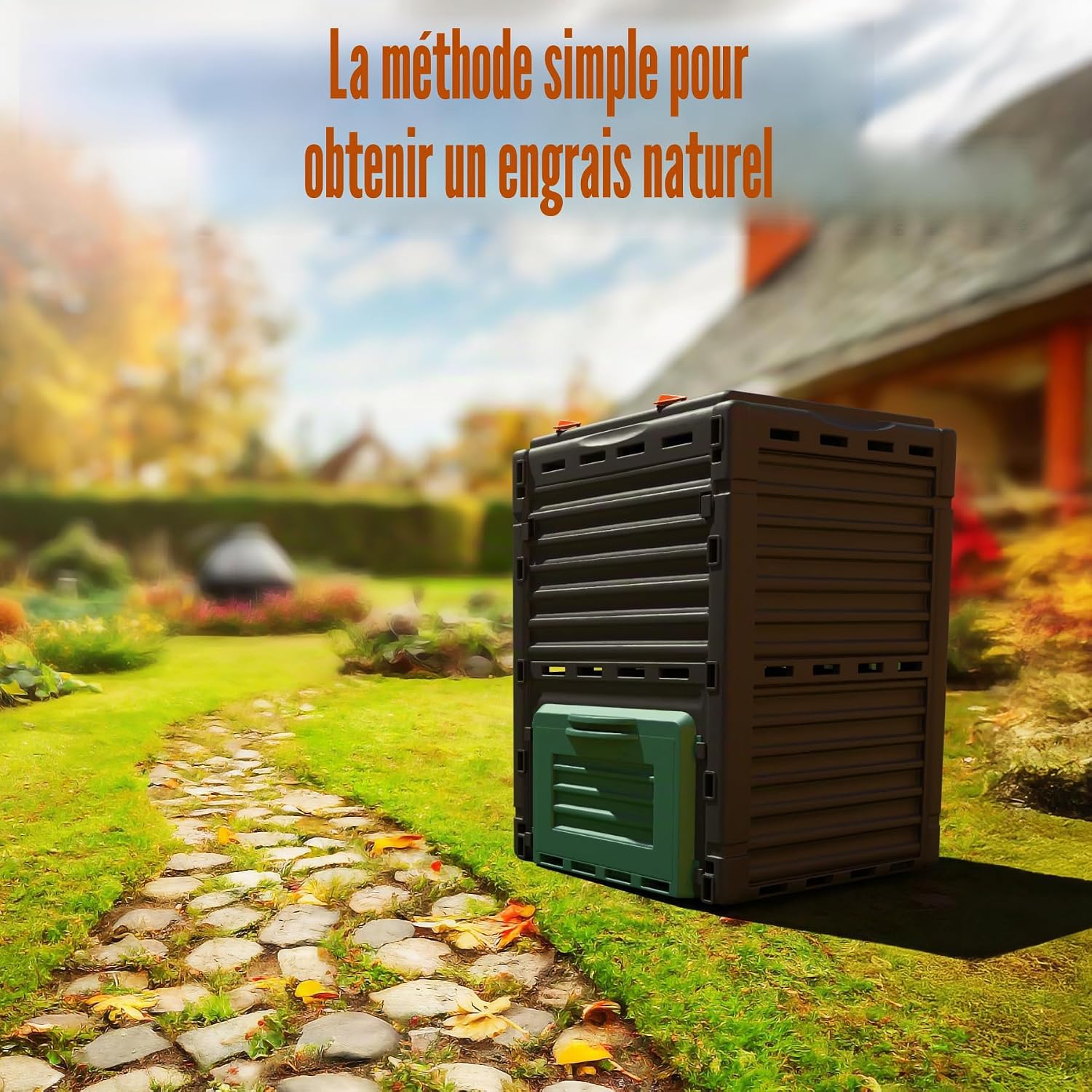 Composteur BigDean installé au bord dune allée de pierres dans un jardin automnal