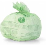 Second cliché du sac compostable vert noué, avec les consignes multilingues imprimées