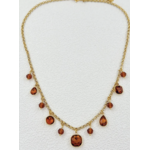 Collier Ravello : Ornements facettés ronds, carrés et en goutte, accompagnés de petites perles