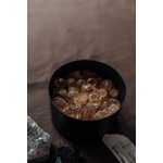 Un Récipient Rond Noir Avec Des Bonbons