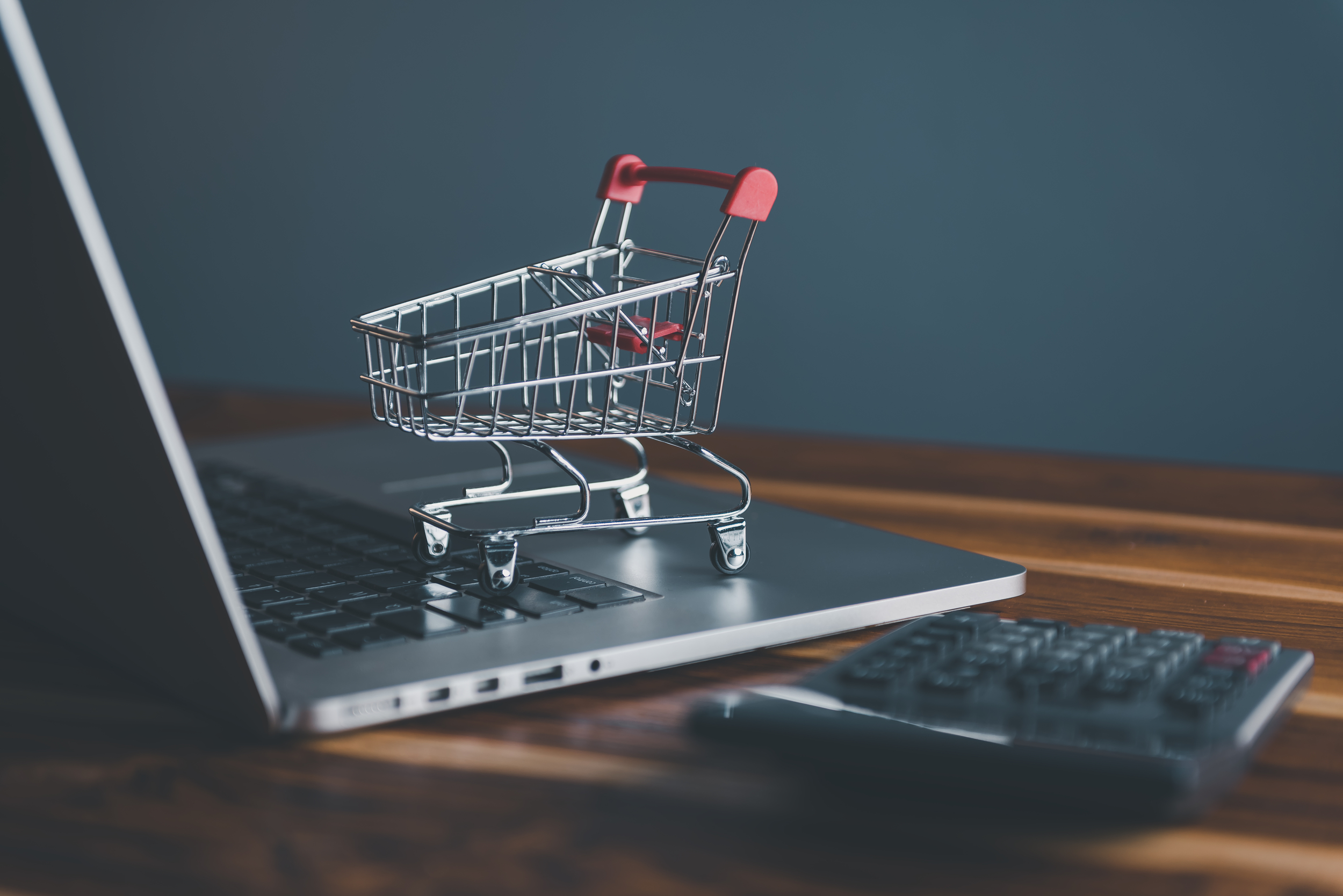 45106402 mini shopping cart on computer laptop for market e commerce advertisement concepts market e commerce online shopping concept business marketing ecommerce via online network