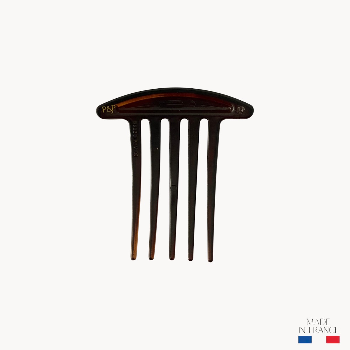 peigne-marron-injecté-5-dents-2-Photoroom