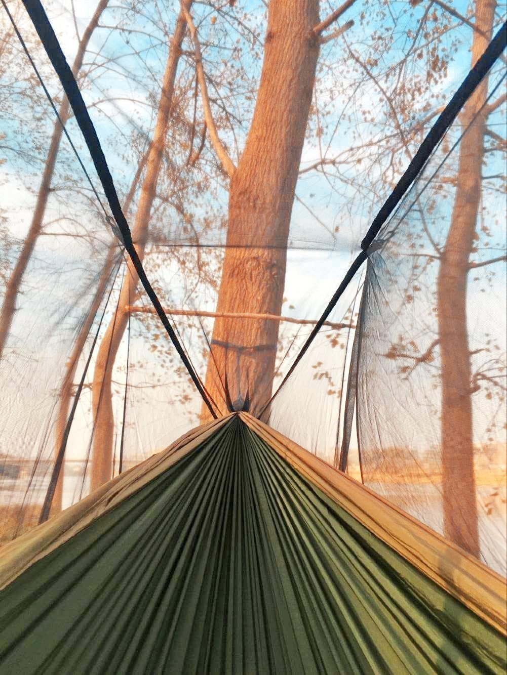 Sunyear 2 Person Hammock Tent – designed with a built-in mosquito net for protection, offering a suspended and secure camping setup in nature.