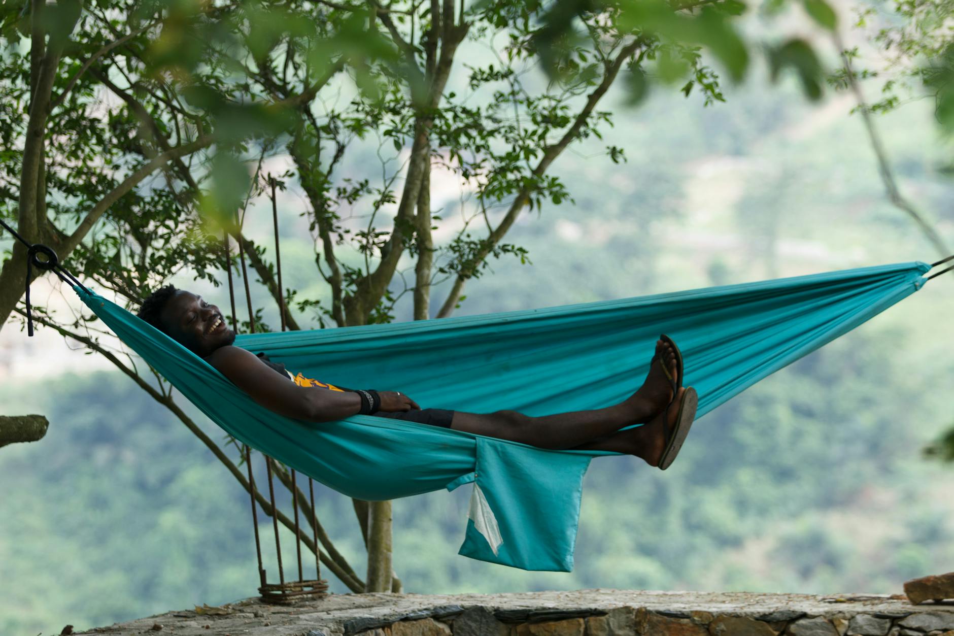 man enjoying leisure time in a hammock surrounded by nature perfect summer relaxation