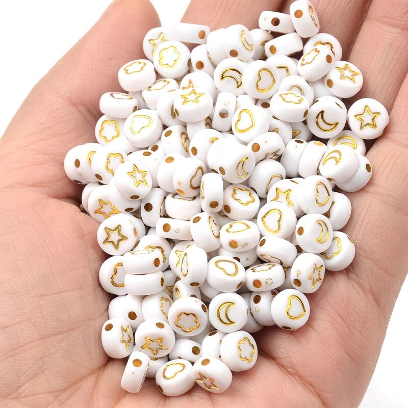 perles lettres et symboles doré