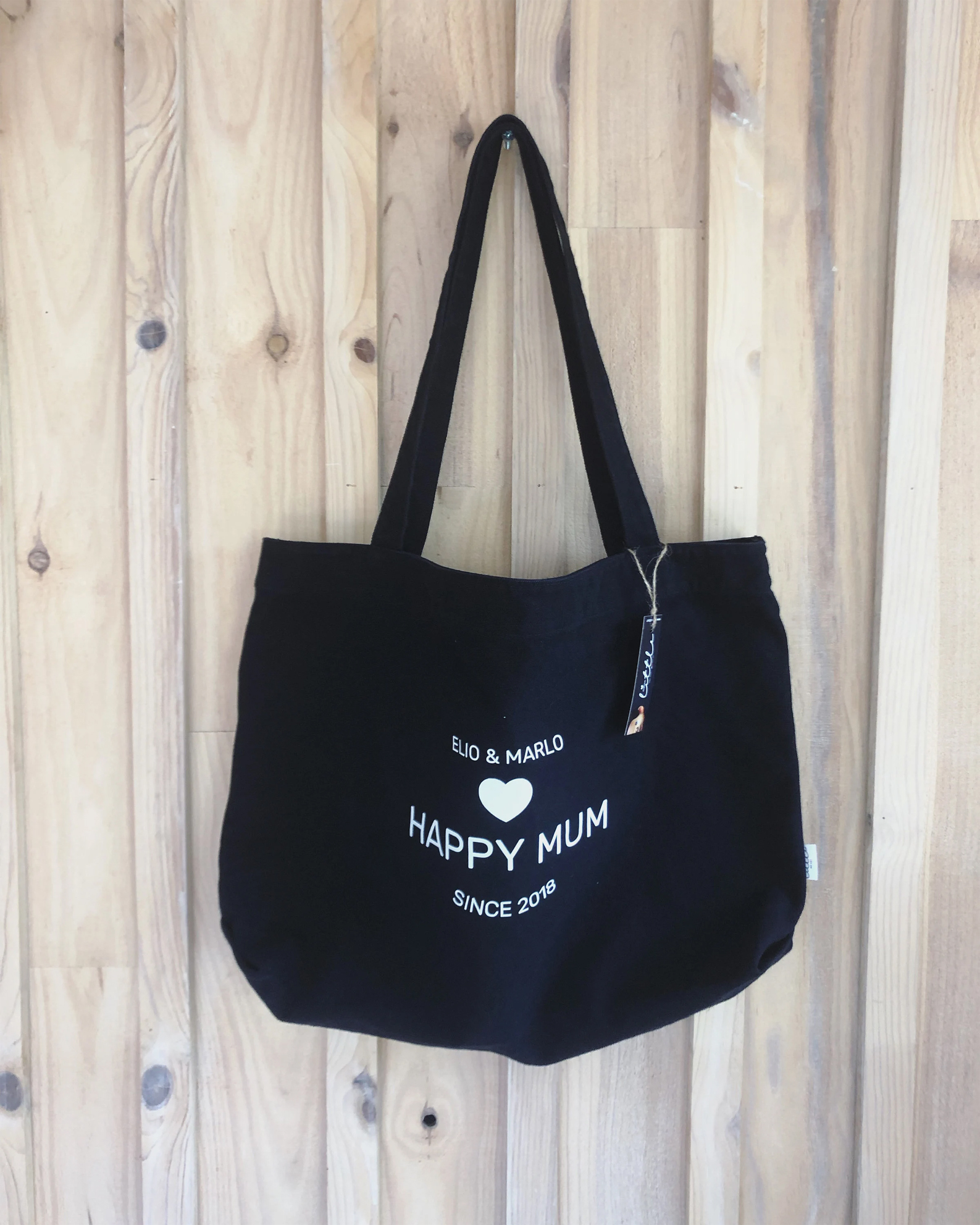 sac personnalisé noir texte motif blanc