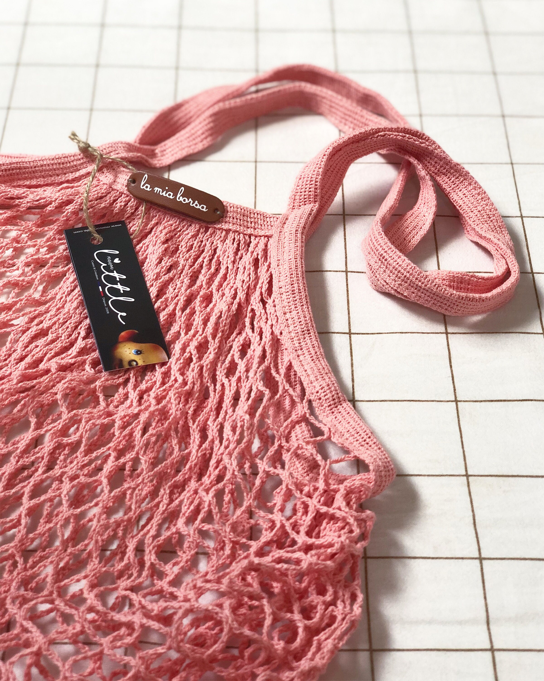 sac épaule courses rose avec mot