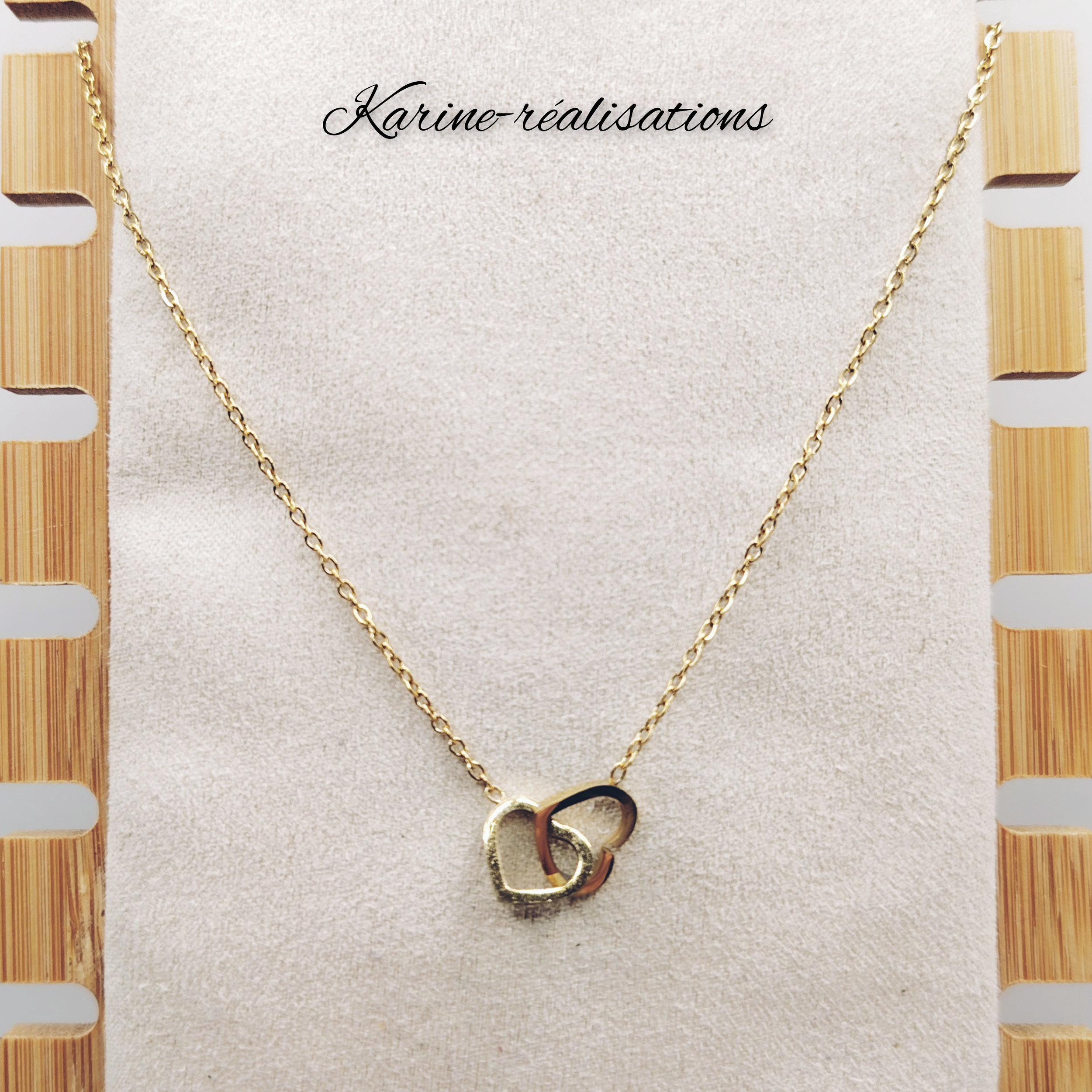 collier-acier-inoxydable-dore-pendentif-deux-coeurs-entrelaces