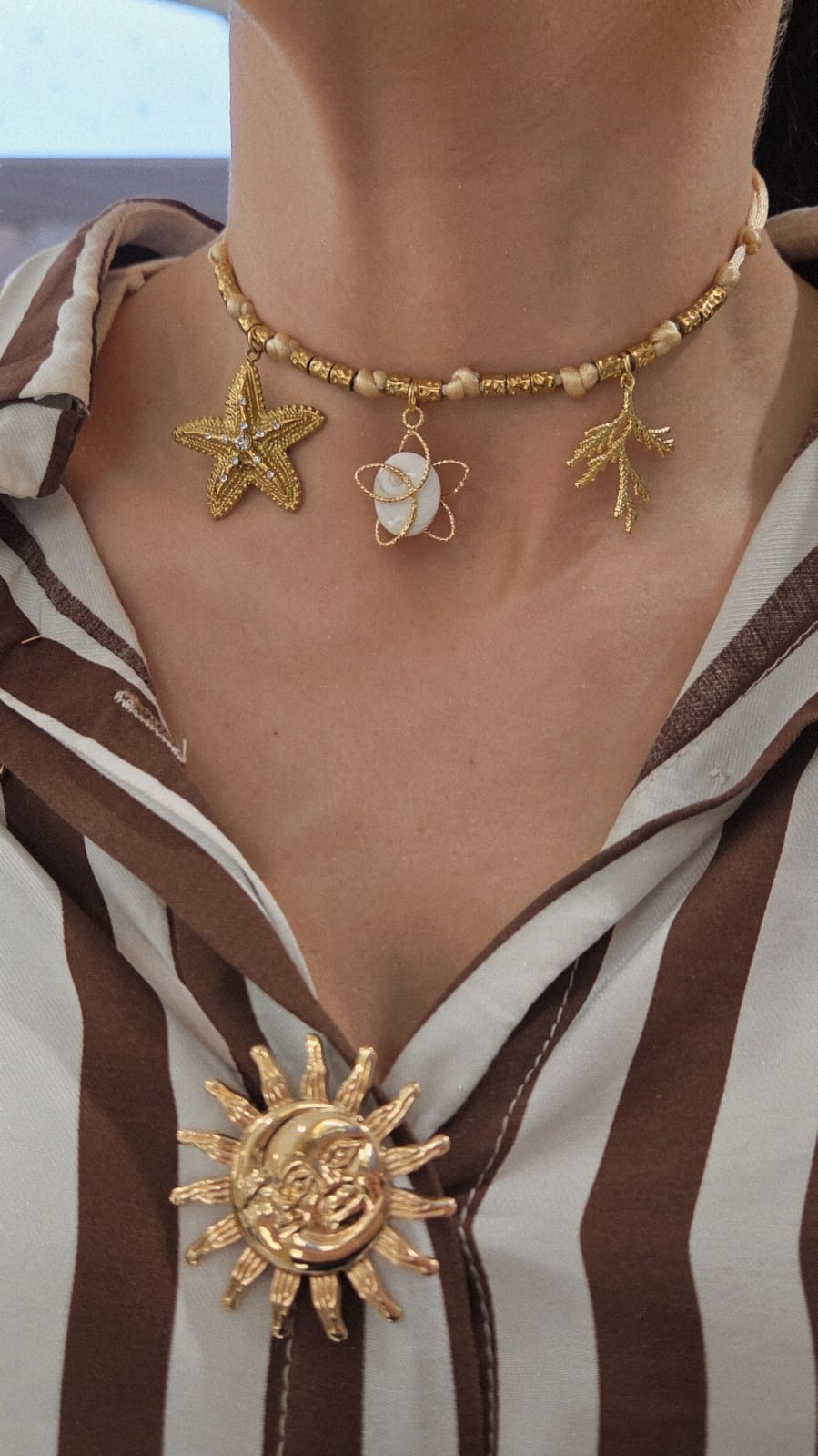 Collier femme oeil de sainte lucie et breloques dorées