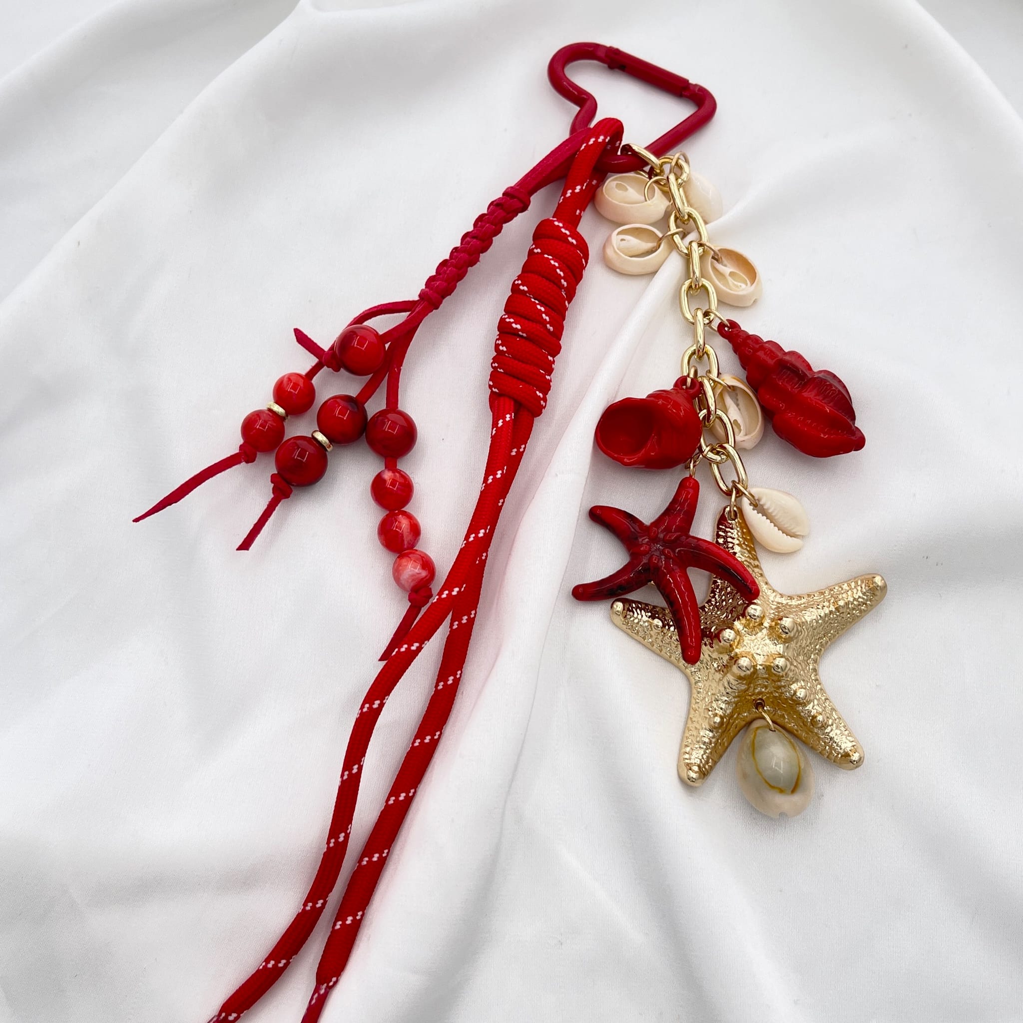 Porte clef grigri de sac étoile dorée et rouge
