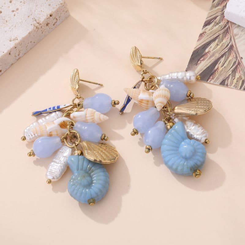 Boucles doreilles fantaisie coquillages femme dorées et bleu