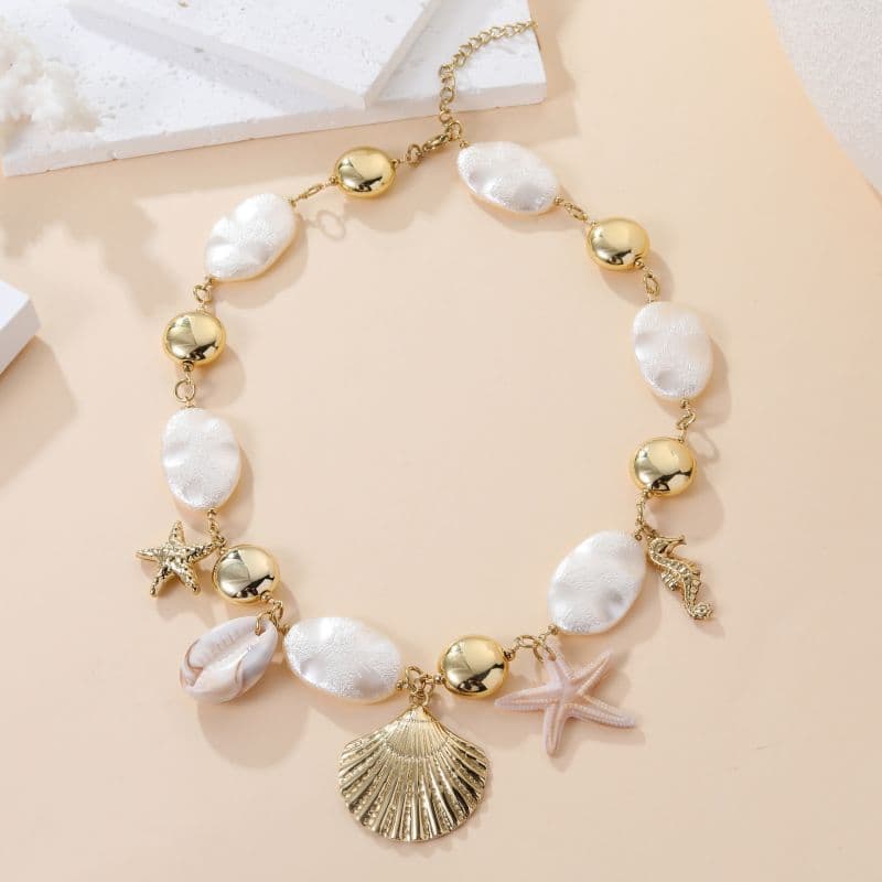 Collier breloques étoiles de mer et coquillages