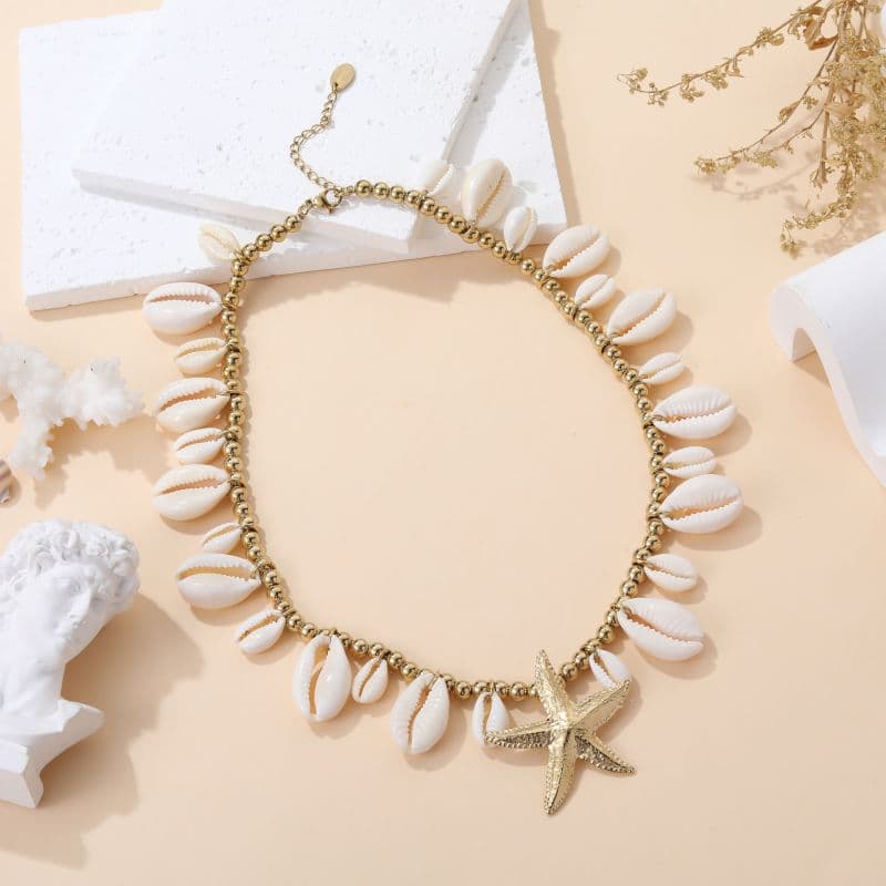 Collier gri-gri chic pampilles étoiles dorées et coquillages