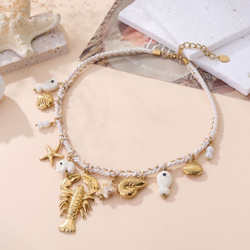 Collier breloques marine femme blanc et doré
