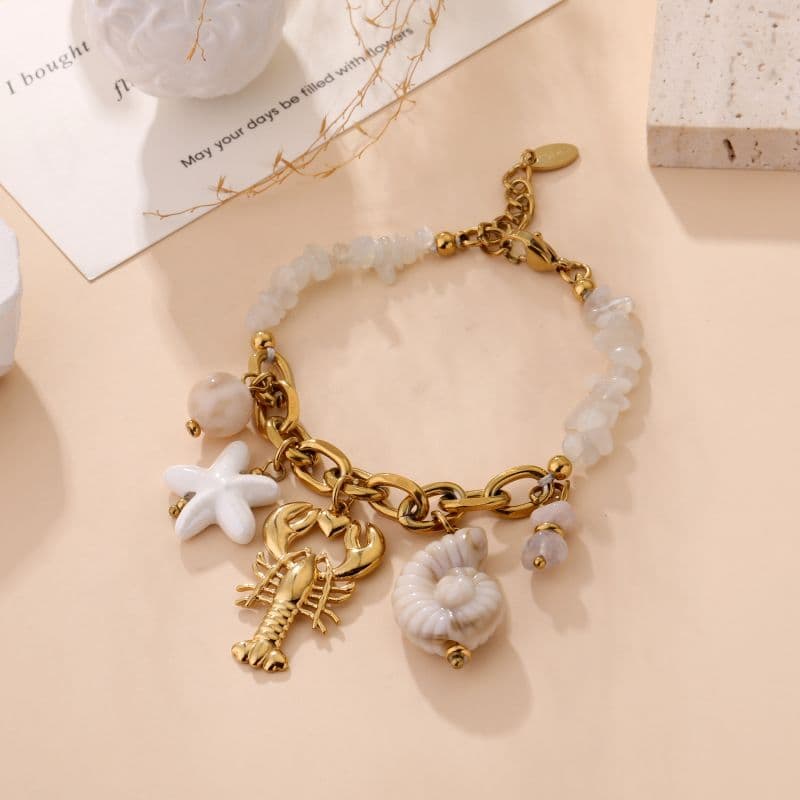 Bracelet homard doré et pierres naturelles blanc