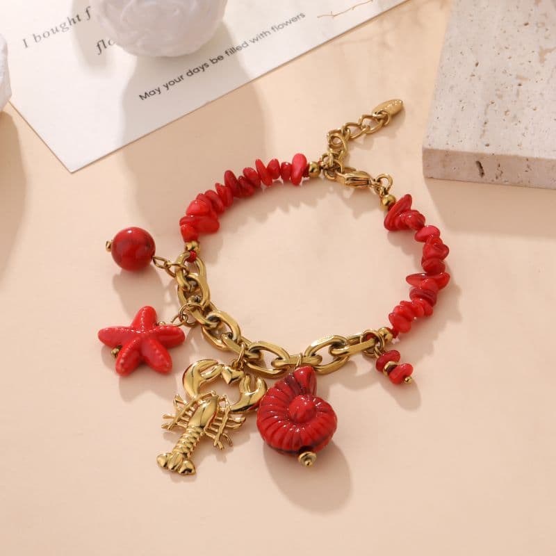 Bracelet homard doré et pierres naturelles rouge