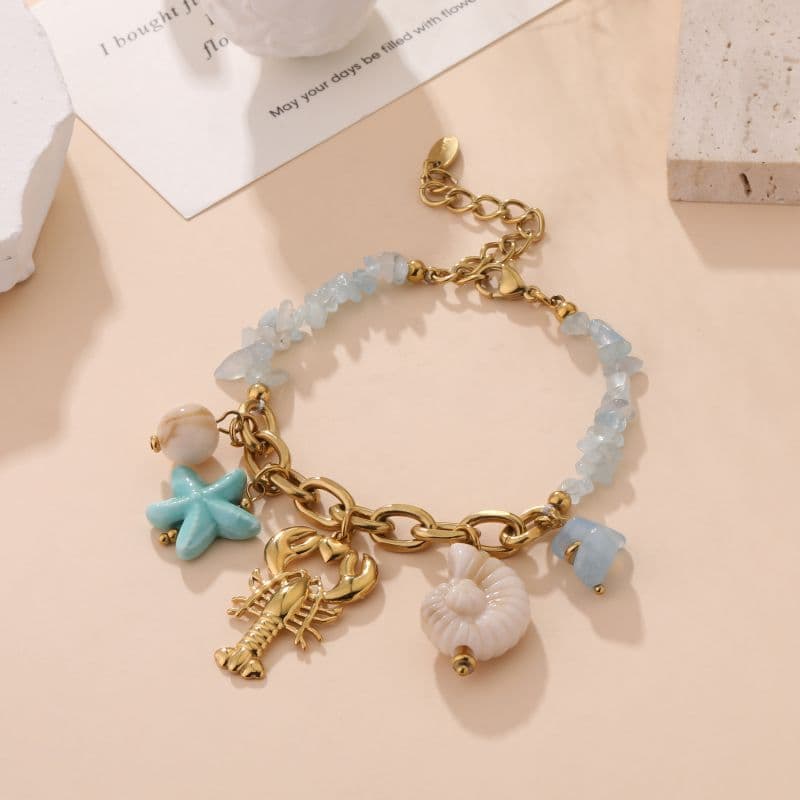 Bracelet homard doré et pierres naturelles bleu