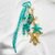 Porte clef grigri de sac étoile turquoise et doré