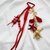 Porte clef grigri de sac étoile dorée et rouge