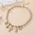 Collier style méditerranéen breloques religieuses dorées