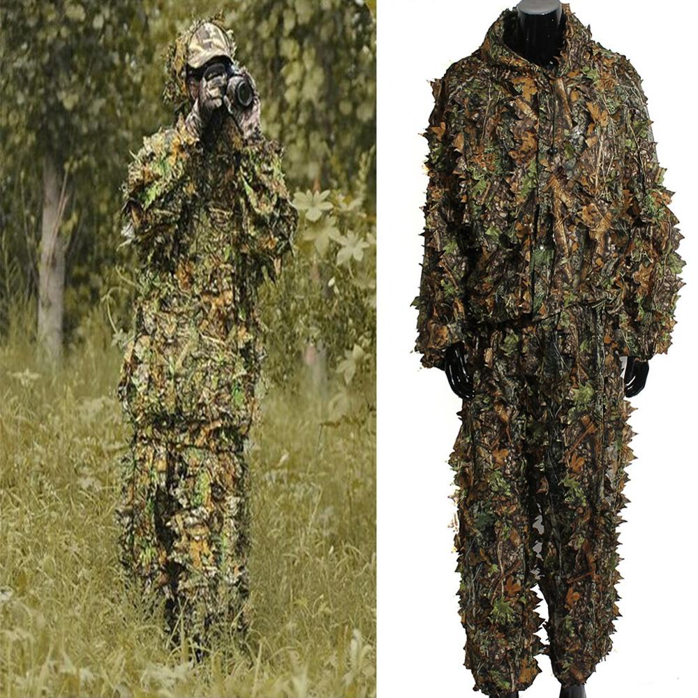 Ghillie suit shown hanging and worn outdoors
