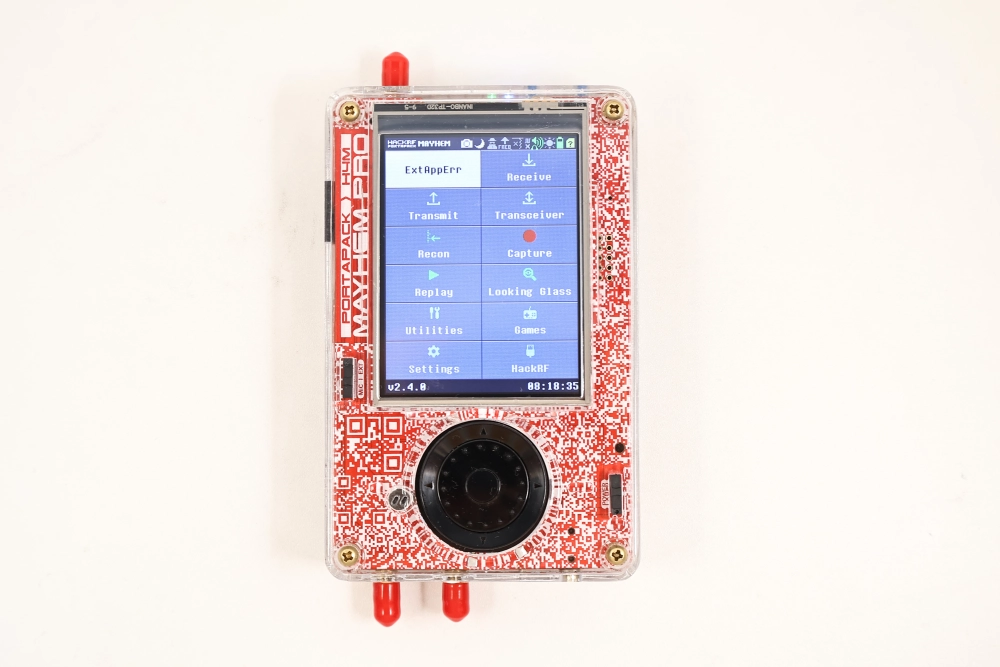 Powered-on HackRF Pro with red PortaPack H4M Pro displaying the Mayhem menu