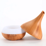 Open wood-effect humidifier spy microphone with water reservoir visible