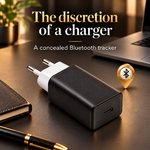 Black charger with a hidden Bluetooth tracker on a desk