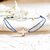 bracelet-croix-cordon-et-nacre