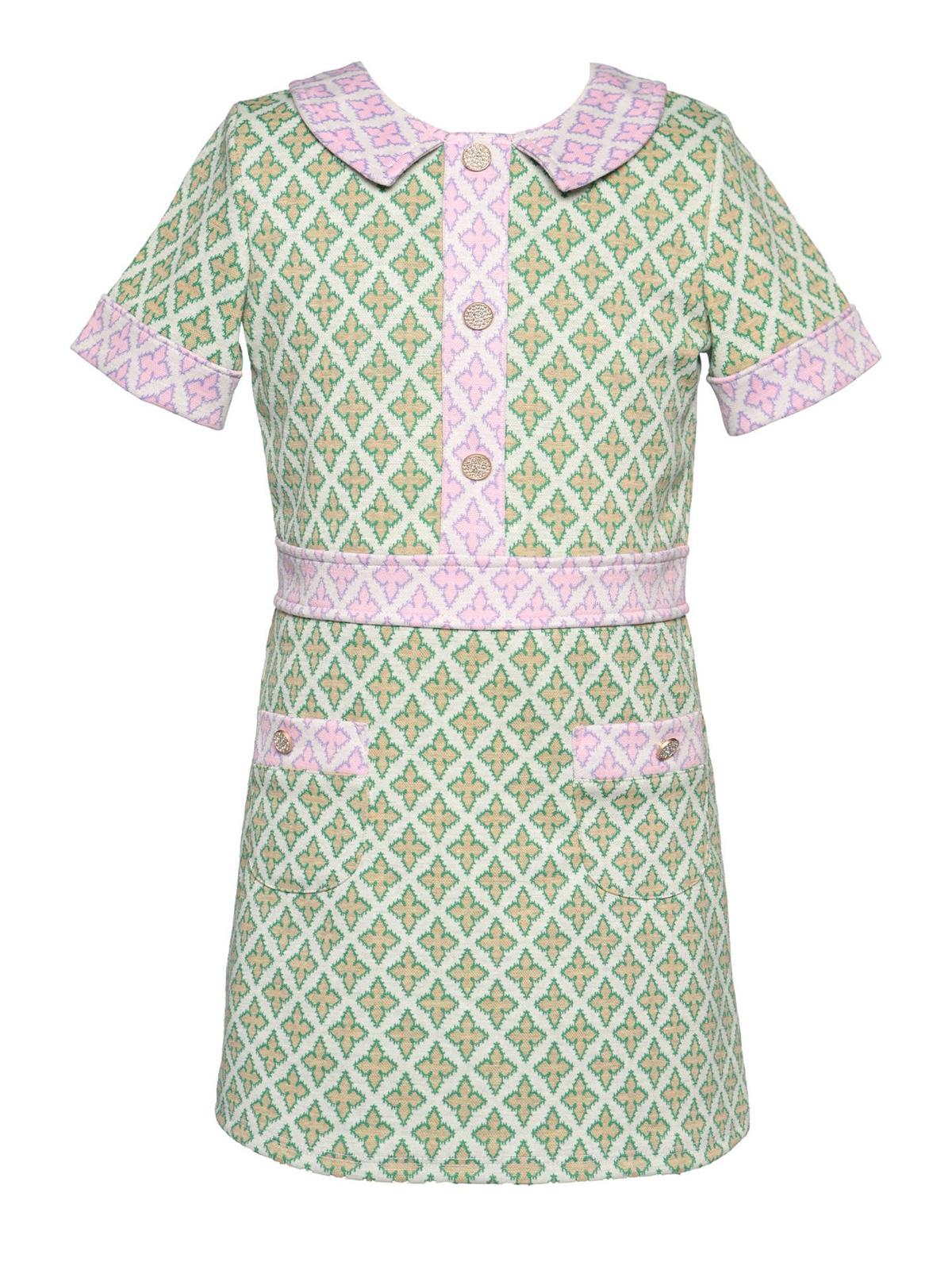Robe moderne bicolore avec boutons en strass