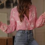 Chemisier rose broderies florales blanches femme