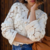 Cardigan blanc brodé à boutons dorés