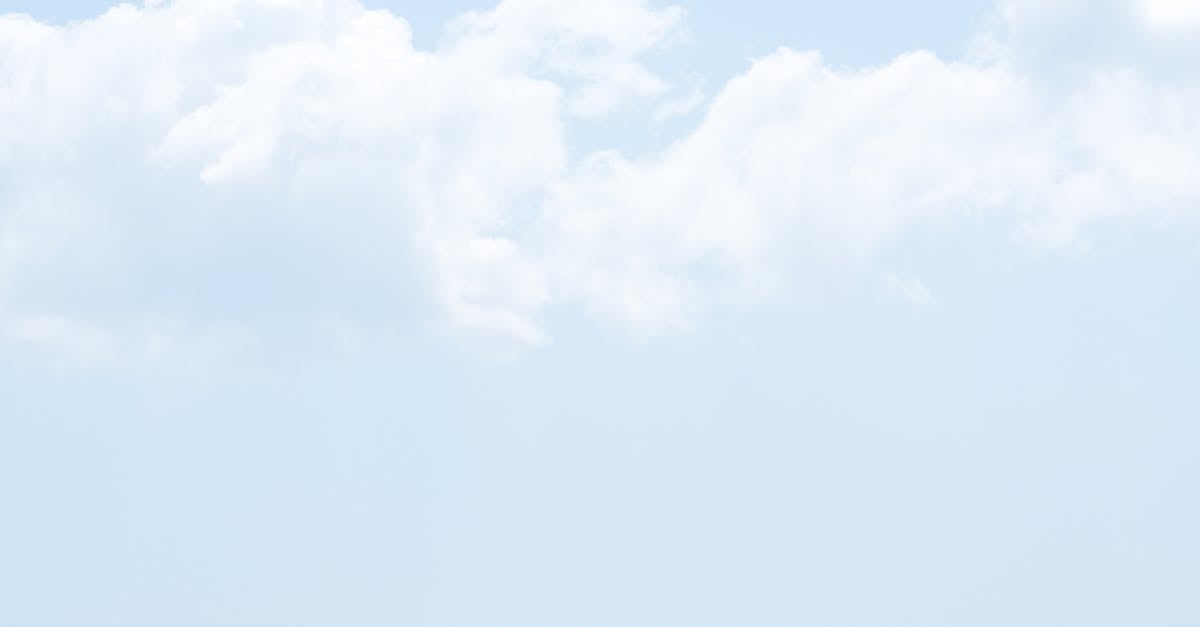 layered blue mountains under fluffy clouds creating a calming scenic view