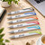 Stylo twist coloré au design fluide ambiance logo