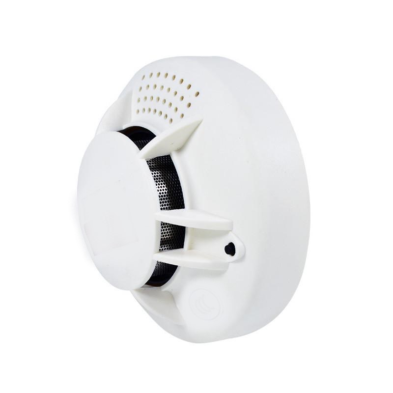 Vue latérale caméra espion détecteur de fumée