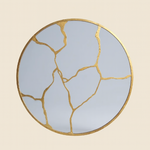 Miroir rond aux veines dorées
