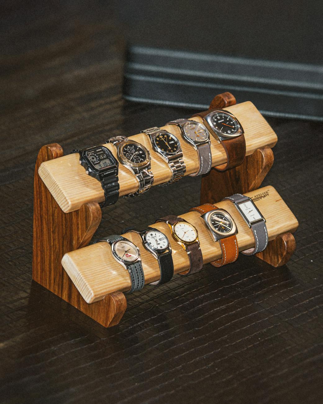 rustic wooden stand elegantly displaying multiple luxury watches perfect for collectors and enthusiasts