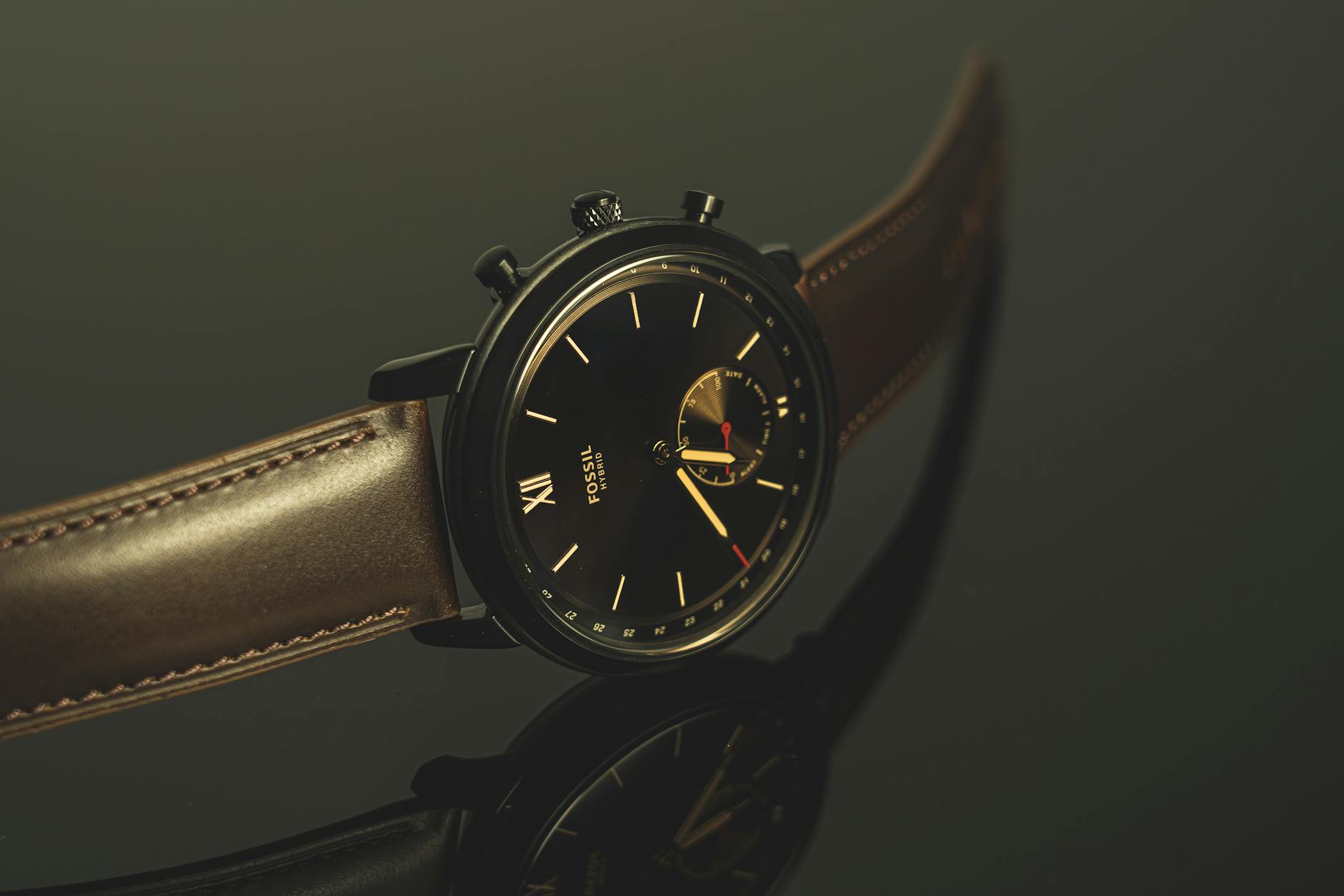 luxurious black wristwatch with leather strap and analog display in close up view