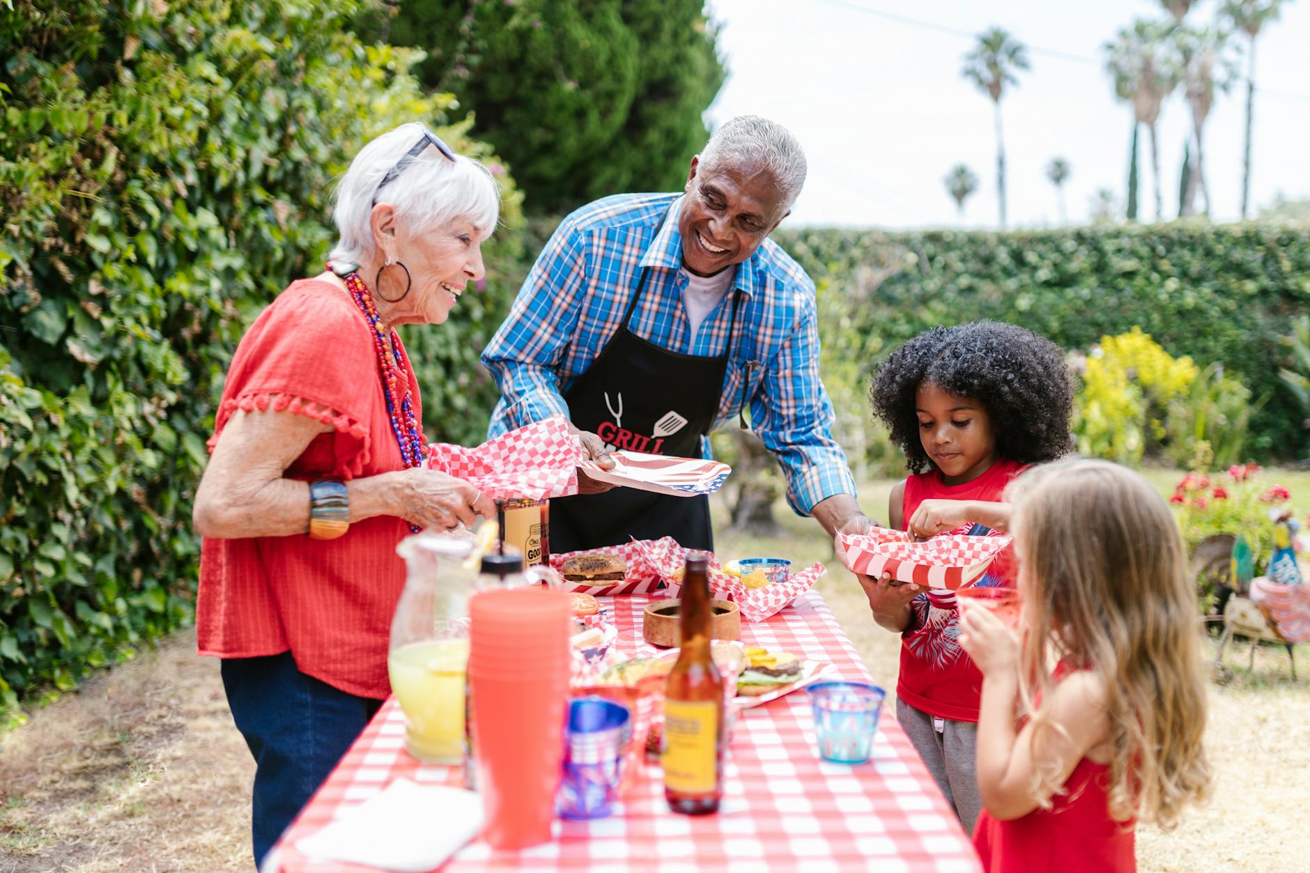 a joyful family gathers outdoors for a picnic enjoying food and togetherness